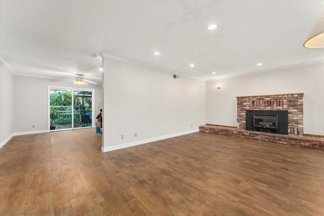 4200 Travona St, Redding, CA 96001 - unfurnished living room featuring wood finished floors, crown molding, recessed lighting, baseboards, and a brick fireplace