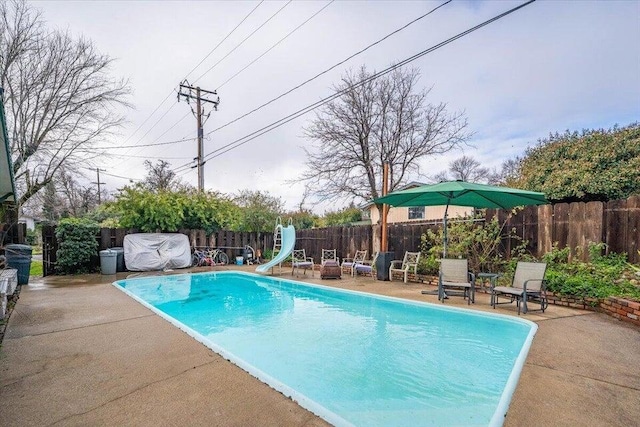 4200 Travona St, Redding, CA 96001 - view of pool with a water slide, a fenced backyard, and a patio area