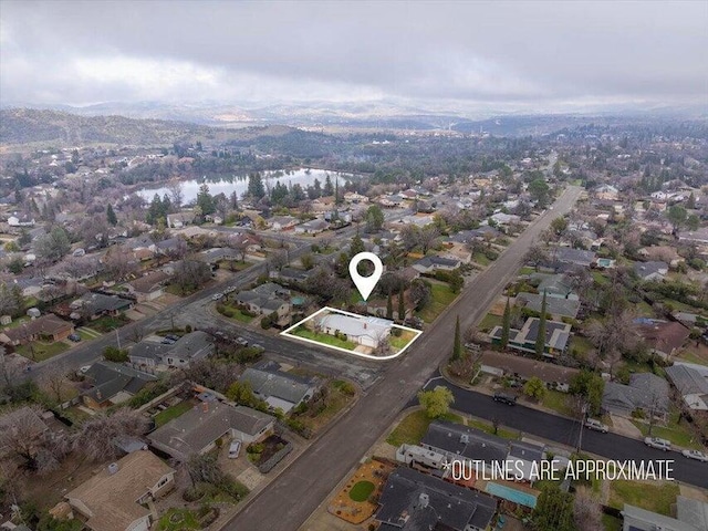 4200 Travona St, Redding, CA 96001 - aerial view of property's location featuring property boundaries highlighted, a water and mountain view, and nearby suburban area
