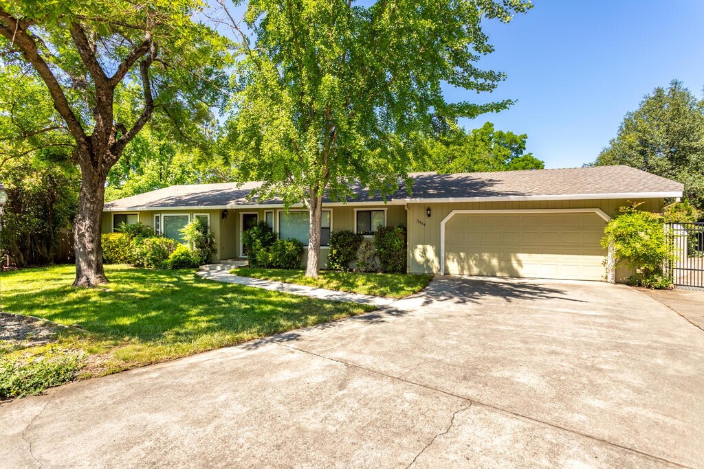 3484 Bello Ct, Redding, CA 96002 - ranch-style house with a garage and driveway