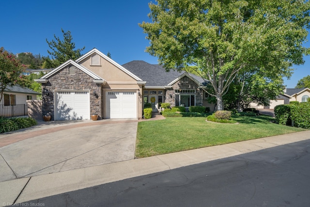 3179 Pinot Path, Redding, CA 96001 - view of front of home featuring stone siding, stucco siding, an attached garage, driveway, and a front yard