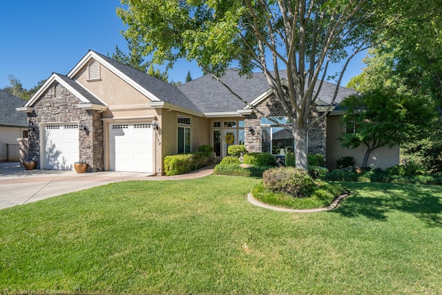 3179 Pinot Path, Redding, CA 96001 - view of front of home with stone siding, an attached garage, driveway, stucco siding, and a front lawn