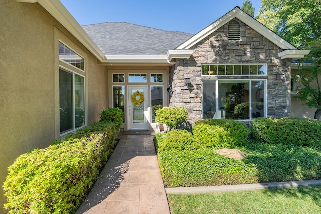 3179 Pinot Path, Redding, CA 96001 - doorway to property with stucco siding, stone siding, and a shingled roof
