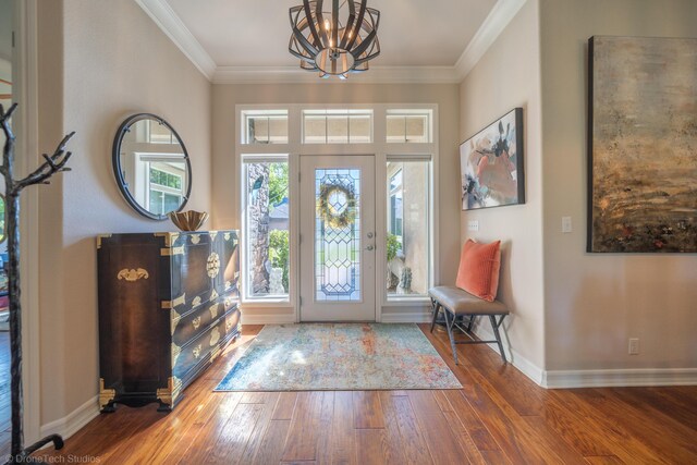 3179 Pinot Path, Redding, CA 96001 - entryway with a chandelier, wood finished floors, baseboards, and ornamental molding