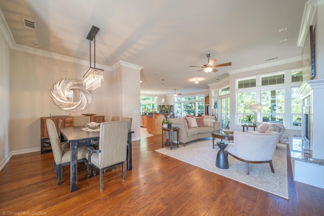 3179 Pinot Path, Redding, CA 96001 - dining room featuring a ceiling fan, wood finished floors, crown molding, and baseboards