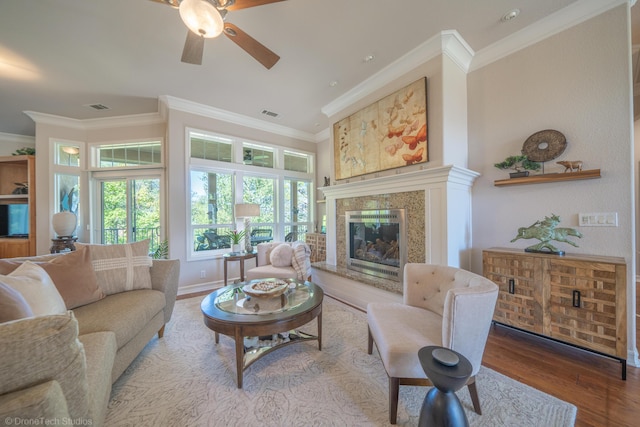 3179 Pinot Path, Redding, CA 96001 - living area featuring ceiling fan, wood finished floors, ornamental molding, a high end fireplace, and baseboards