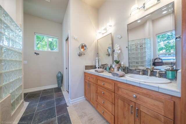 3179 Pinot Path, Redding, CA 96001 - full bath featuring double vanity, baseboards, a tub to relax in, and tiled shower