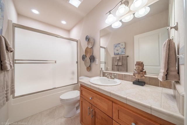 3179 Pinot Path, Redding, CA 96001 - bathroom featuring vanity, toilet, tile patterned floors, and shower / bath combination with glass door
