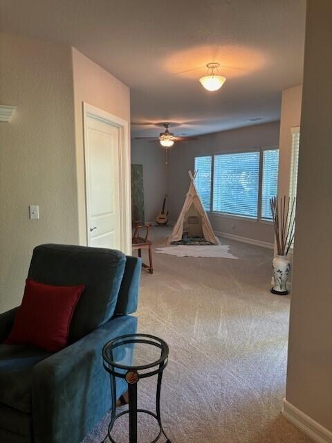 3179 Pinot Path, Redding, CA 96001 - sitting room with carpet, a ceiling fan, and baseboards
