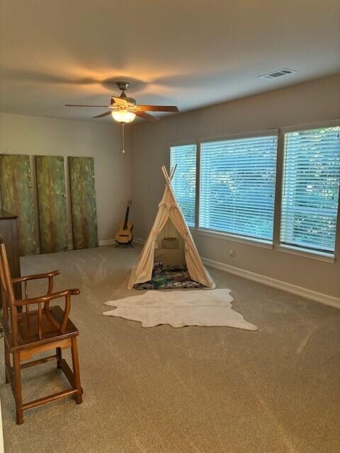 3179 Pinot Path, Redding, CA 96001 - playroom featuring carpet floors, baseboards, and ceiling fan