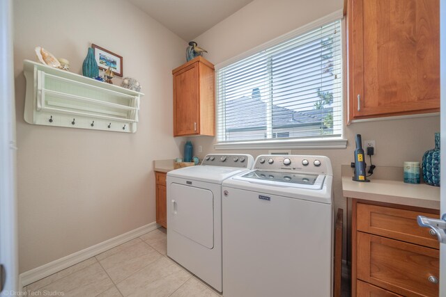 3179 Pinot Path, Redding, CA 96001 - laundry room featuring washing machine and dryer, cabinet space, baseboards, and light tile patterned floors