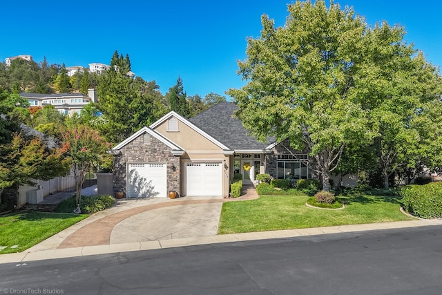 3179 Pinot Path, Redding, CA 96001 - view of front facade with stucco siding, driveway, stone siding, and an attached garage