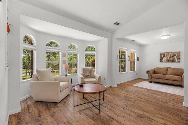21247 Creekside Dr, Red Bluff, CA 96080 - living area featuring hardwood / wood-style flooring, plenty of natural light, baseboards, and lofted ceiling