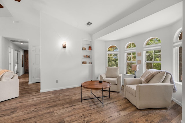 21247 Creekside Dr, Red Bluff, CA 96080 - sitting room with built in features, wood finished floors, baseboards, ceiling fan, and lofted ceiling