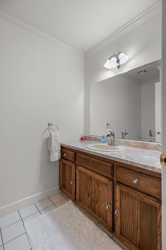 21247 Creekside Dr, Red Bluff, CA 96080 - bathroom featuring vanity, ornamental molding, tile patterned floors, and baseboards