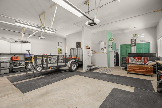 21247 Creekside Dr, Red Bluff, CA 96080 - garage featuring a garage door opener and a ceiling fan