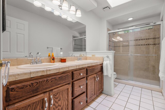 21247 Creekside Dr, Red Bluff, CA 96080 - full bath with tile patterned flooring, double vanity, toilet, and a shower stall