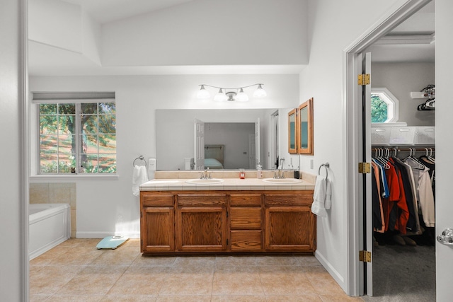 21247 Creekside Dr, Red Bluff, CA 96080 - bathroom with double vanity, tile patterned floors, a bathtub, and baseboards