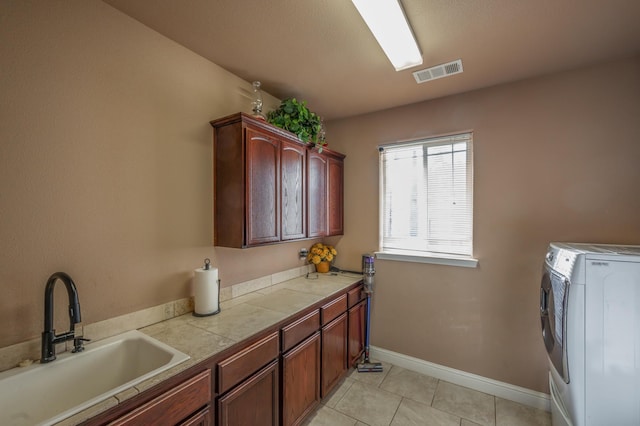 13787 Walter Ave, Redding, CA 96003 - washroom with cabinet space, washer and dryer, light tile patterned flooring, and baseboards