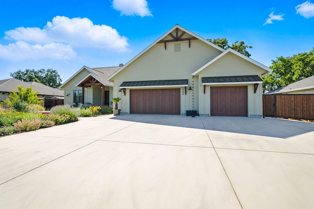 180 Agua Verdi Dr, Red Bluff, CA 96080 - modern farmhouse with board and batten siding, a garage, driveway, a standing seam roof, and a metal roof