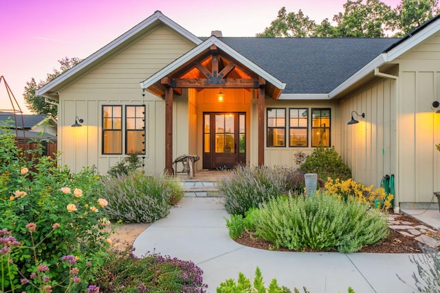 180 Agua Verdi Dr, Red Bluff, CA 96080 - exterior entry at dusk featuring board and batten siding and roof with shingles