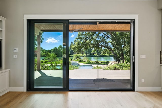 180 Agua Verdi Dr, Red Bluff, CA 96080 - doorway to outside with a water view and wood finished floors