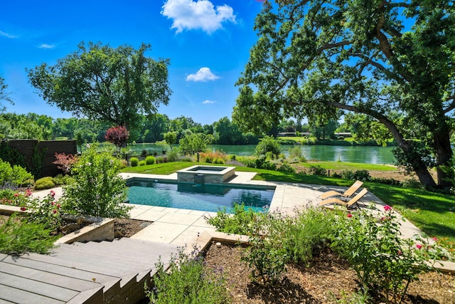 180 Agua Verdi Dr, Red Bluff, CA 96080 - view of pool with a water view, a pool with connected hot tub, and a patio area