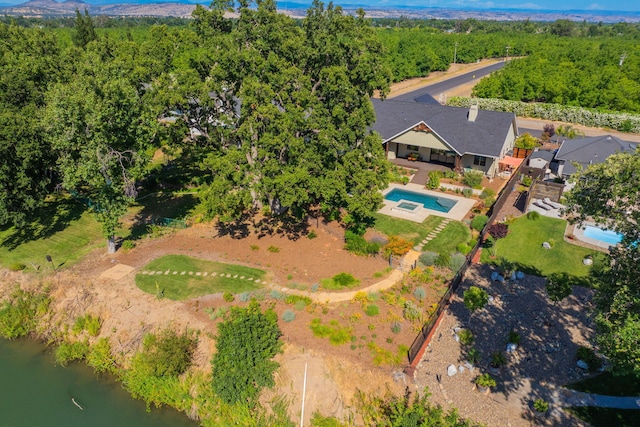 180 Agua Verdi Dr, Red Bluff, CA 96080 - aerial view of property and surrounding area with a pool area and a heavily wooded area