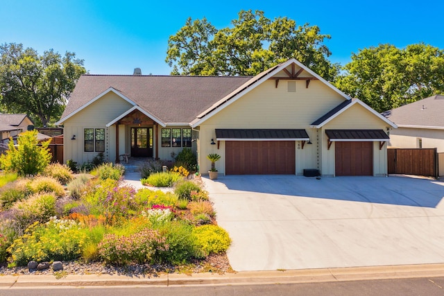 180 Agua Verdi Dr, Red Bluff, CA 96080 - view of front of home featuring board and batten siding, a garage, driveway, and a shingled roof
