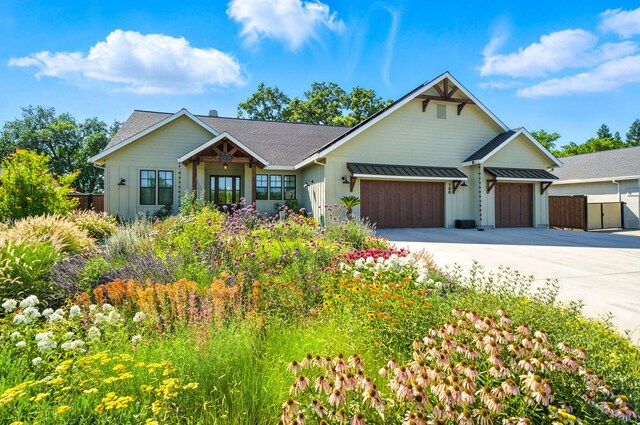 180 Agua Verdi Dr, Red Bluff, CA 96080 - view of front of home with board and batten siding, a garage, and driveway