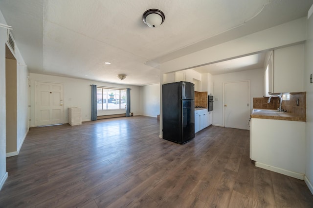 852 Lake Blvd, Redding, CA 96003 - kitchen with black appliances, a sink, open floor plan, dark wood-style floors, and white cabinets