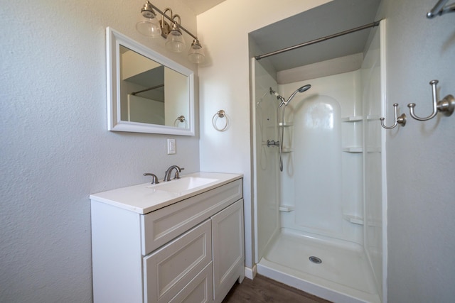 852 Lake Blvd, Redding, CA 96003 - bathroom with vanity, a shower, and wood finished floors