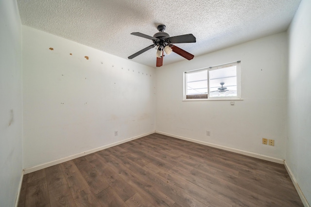 852 Lake Blvd, Redding, CA 96003 - spare room with a textured ceiling, dark wood finished floors, a ceiling fan, and baseboards