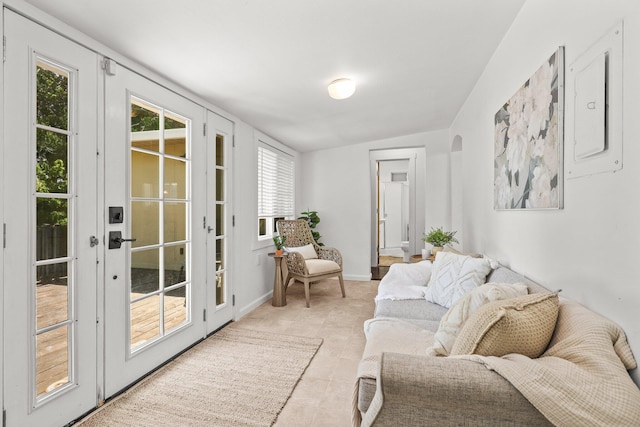 1545 Olive Ave, Redding, CA 96001 - living room with electric panel, light tile patterned flooring, and french doors