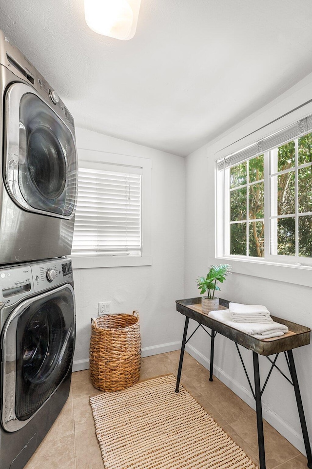 1545 Olive Ave, Redding, CA 96001 - washroom with stacked washer and clothes dryer and tile patterned flooring
