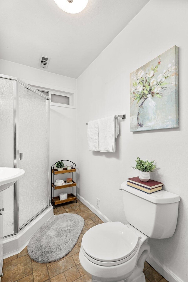 1545 Olive Ave, Redding, CA 96001 - bathroom with a shower stall and toilet