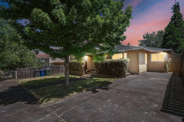1545 Olive Ave, Redding, CA 96001 - view of front of house with concrete driveway and stucco siding