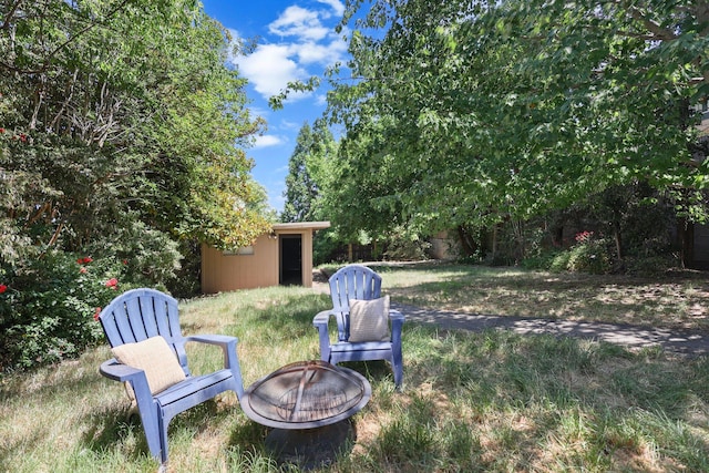 1545 Olive Ave, Redding, CA 96001 - view of yard featuring a fire pit and an outdoor structure