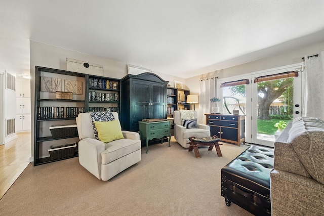 6966 Granada Dr, Redding, CA 96002 - living area with french doors and carpet floors