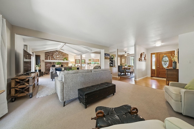 6966 Granada Dr, Redding, CA 96002 - carpeted living area featuring a ceiling fan, a brick fireplace, and wood finished floors