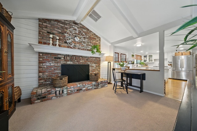 6966 Granada Dr, Redding, CA 96002 - living area featuring light carpet and a fireplace