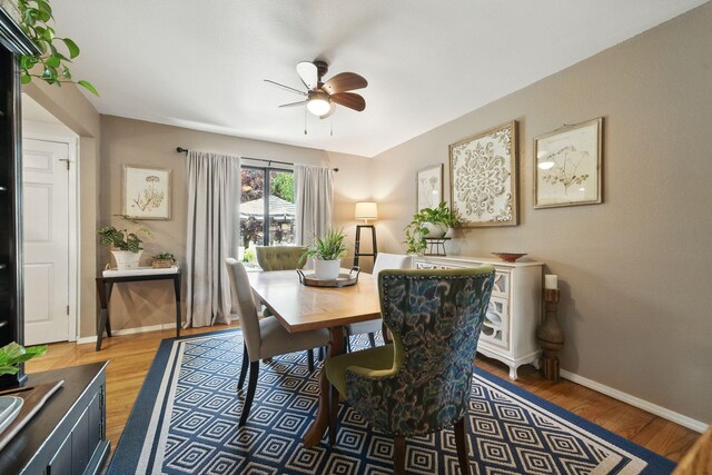 6966 Granada Dr, Redding, CA 96002 - dining space with a ceiling fan, wood finished floors, and baseboards