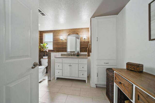 6966 Granada Dr, Redding, CA 96002 - bathroom with vanity, toilet, and tile patterned flooring