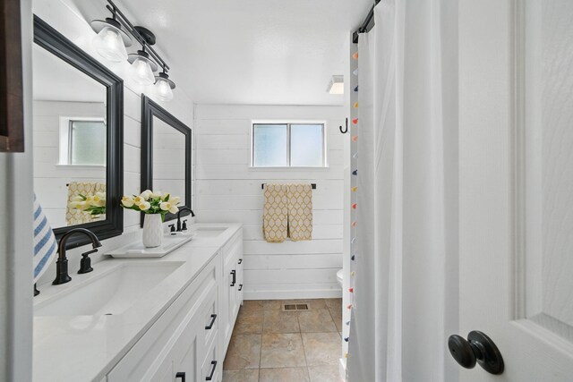 6966 Granada Dr, Redding, CA 96002 - full bath with plenty of natural light, double vanity, toilet, and curtained shower
