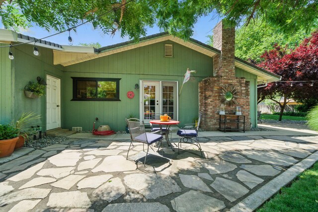 6966 Granada Dr, Redding, CA 96002 - back of property featuring a patio area, a chimney, and french doors