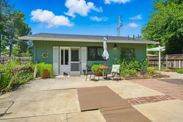 6966 Granada Dr, Redding, CA 96002 - back of property featuring a patio and roof with shingles