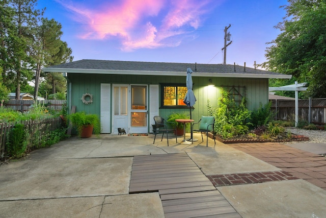 6966 Granada Dr, Redding, CA 96002 - rear view of property with a shingled roof and a patio area
