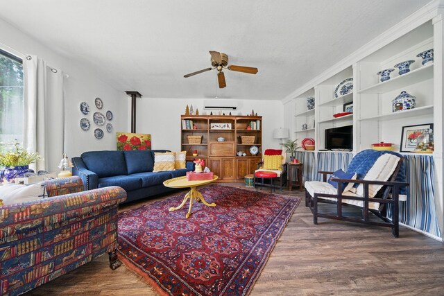 6966 Granada Dr, Redding, CA 96002 - living room featuring ceiling fan, wood finished floors, and built in shelves