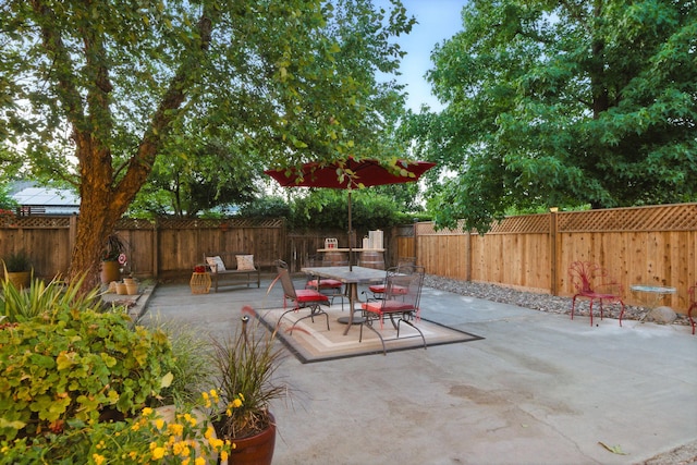 6966 Granada Dr, Redding, CA 96002 - fenced backyard featuring a patio area and outdoor dining space