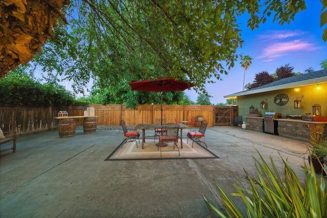 6966 Granada Dr, Redding, CA 96002 - fenced backyard featuring a patio area, outdoor dining area, and a gate
